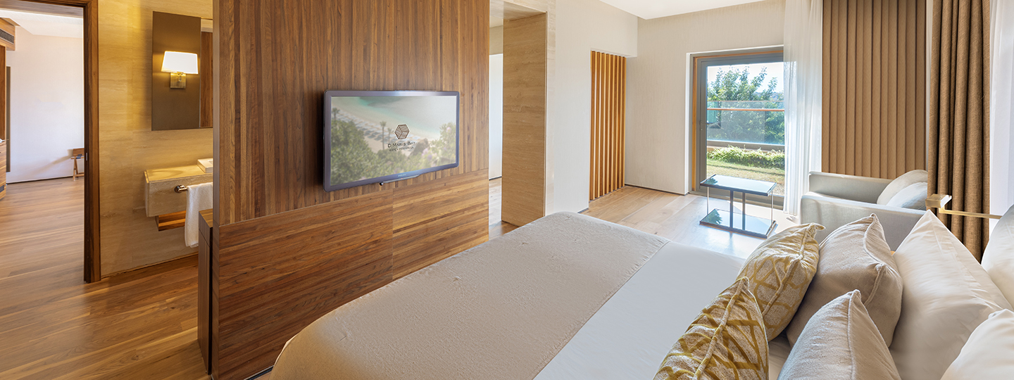 A premiere suite at D Maris Bay, with lush furnishings and wooden panelling ensures a serene stay for guests.  