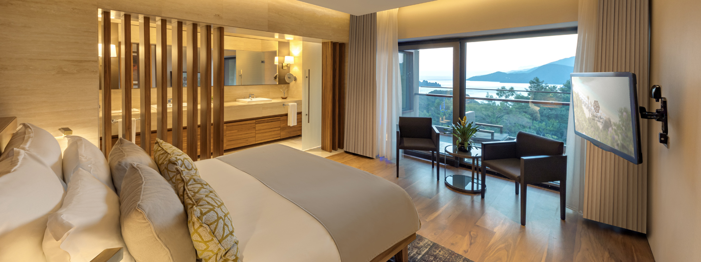A luxury executive partial sea view suite at D Maris Bay resort. The modern interior has sumptuous furnishings and large double vanity ensuite, ensuring guest have a decadent stay. 