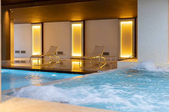 A view of the luxurious heated indoor pool available at the wellness facilities at D Maris Bay resort.