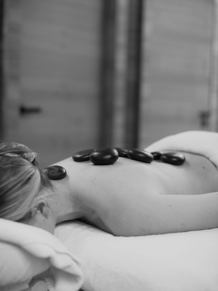 A woman receives a relaxing hot stone spa treatment at in the Mytha Spa at D Maris Bay resort.