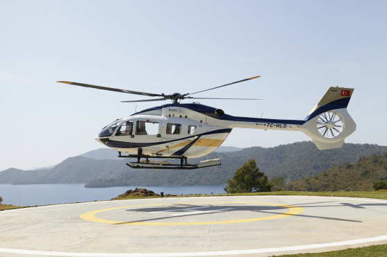 A luxury  private helicopter takes off with guests from D Maris Bay to tour the coastline and the scenic view.