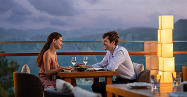 A couple sit down to eat a romantic meal for two at Zuma Restaurant in D Maris Bay resort.