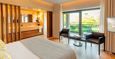 A luxury executive partial sea view suite at D Maris Bay resort. The modern interior has sumptuous furnishings and large double vanity ensuite, ensuring guest have a decadent stay. 