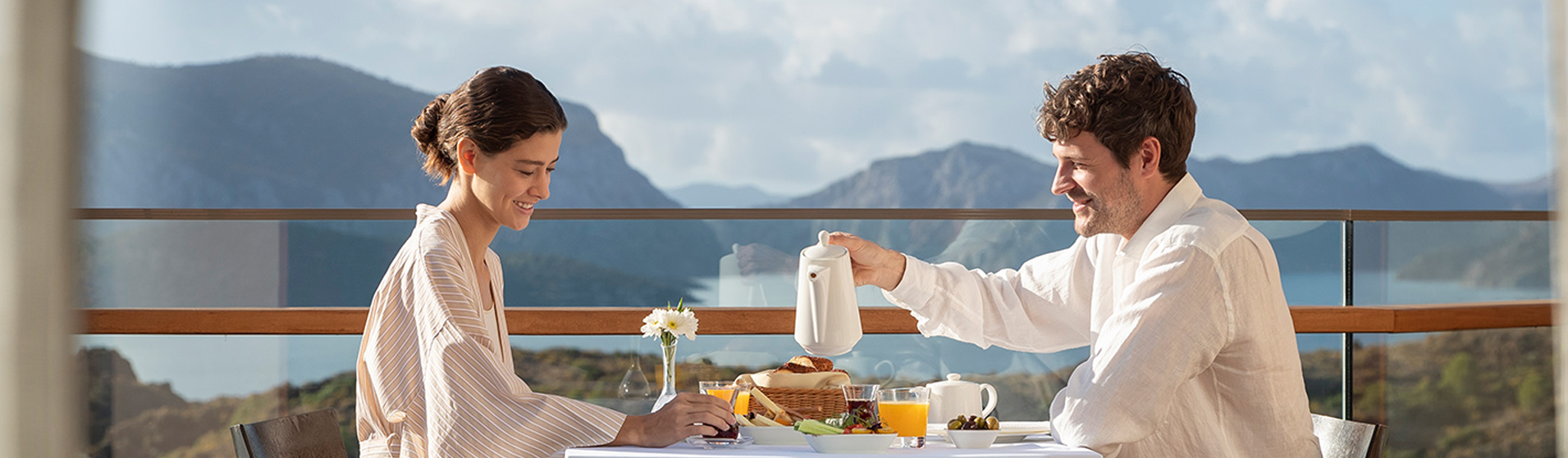  A couple enjoy an al fresco breakfast on the balcony of their room at the D Maris Bay resort